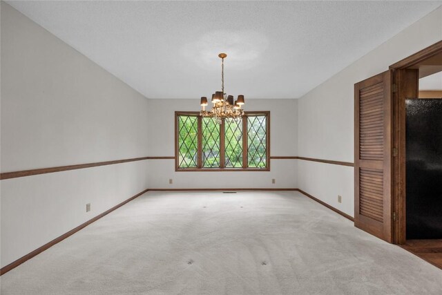 4633 Northwood Dr NE, Cedar Rapids, IA 52402 - carpeted empty room featuring a chandelier and baseboards