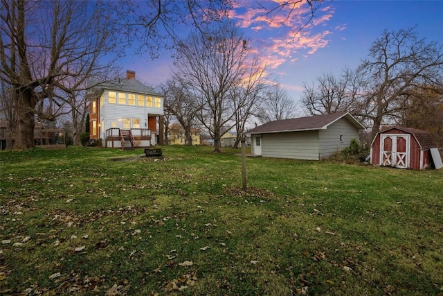 320 E St, Tipton, IA 52772 - yard at dusk featuring a lawn
