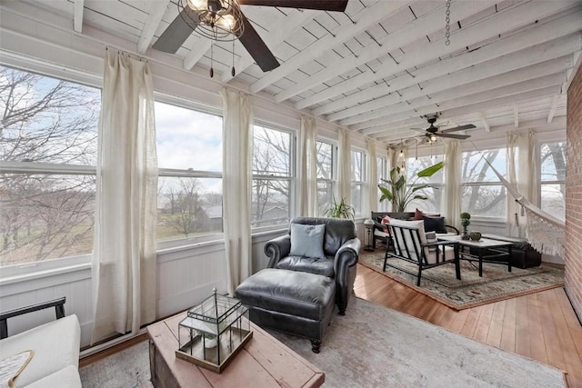320 E St, Tipton, IA 52772 - sunroom / solarium featuring ceiling fan, hardwood / wood-style floors, wooden ceiling, an outdoor living space, and a deck