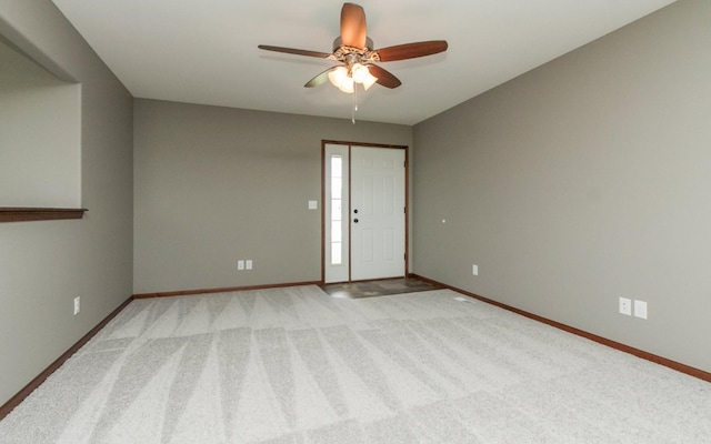 3806 English Glen Ave, Marion, IA 52302 - spare room with baseboards, a ceiling fan, and light carpet