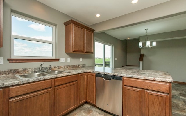3806 English Glen Ave, Marion, IA 52302 - kitchen featuring dishwasher, a sink, a peninsula, stone finish flooring, and brown cabinets