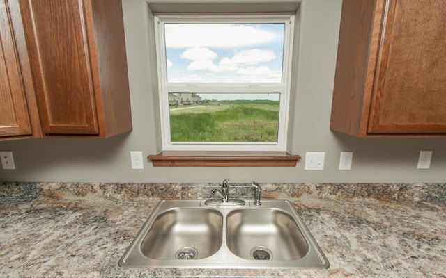 3806 English Glen Ave, Marion, IA 52302 - kitchen view of a sink and brown cabinetry