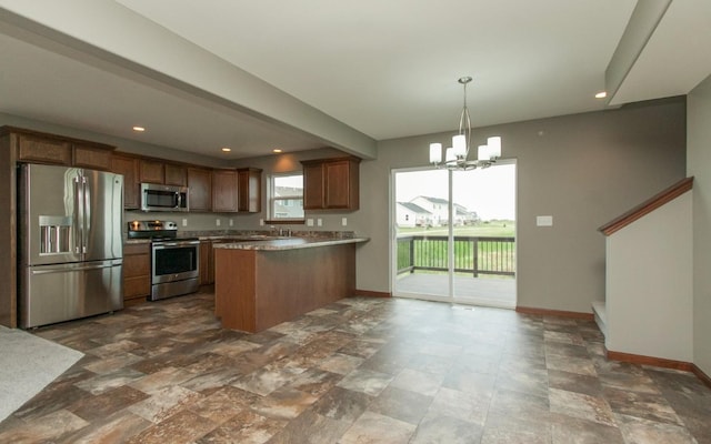 3806 English Glen Ave, Marion, IA 52302 - kitchen with stainless steel appliances, baseboards, a peninsula, a chandelier, and recessed lighting