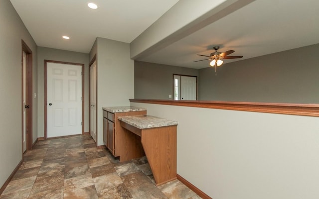 3806 English Glen Ave, Marion, IA 52302 - bar area featuring baseboards, ceiling fan, stone finish floors, and recessed lighting