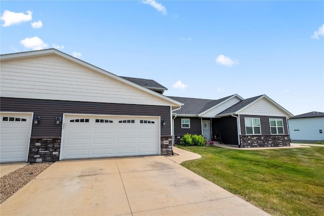 3806 English Glen Ave, Marion, IA 52302 - view of front of property featuring driveway, stone siding, a front lawn, and an attached garage