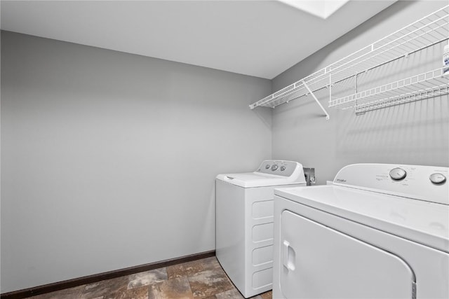 3806 English Glen Ave, Marion, IA 52302 - laundry room with washing machine and dryer and stone finish floors
