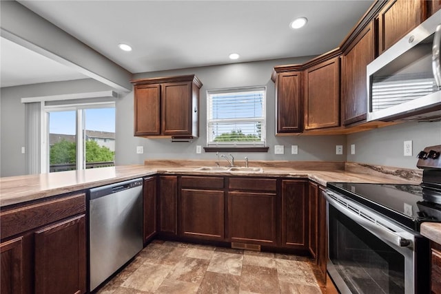 3806 English Glen Ave, Marion, IA 52302 - kitchen featuring appliances with stainless steel finishes, light countertops, recessed lighting, and stone finish floors