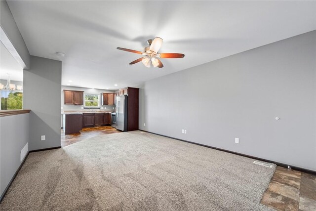 3806 English Glen Ave, Marion, IA 52302 - unfurnished living room featuring ceiling fan and light colored carpet