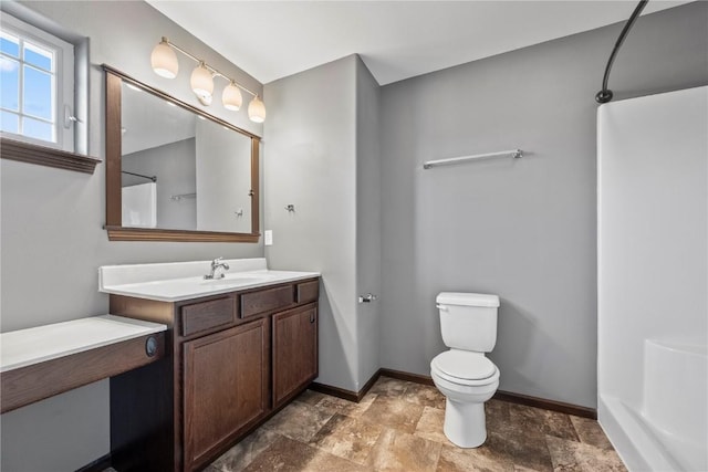 3806 English Glen Ave, Marion, IA 52302 - bathroom featuring vanity, stone finish flooring, and a shower