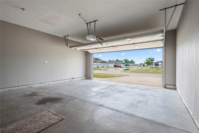 3806 English Glen Ave, Marion, IA 52302 - garage featuring a garage door opener and a residential view