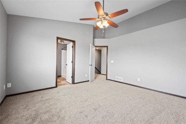 3806 English Glen Ave, Marion, IA 52302 - unfurnished bedroom with light carpet, vaulted ceiling, a ceiling fan, and ensuite bathroom