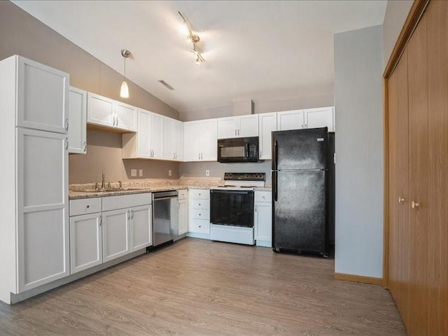 4619 1st Ave Unit 9, Cedar Rapids, IA 52404 - kitchen featuring black appliances, a sink, lofted ceiling, light wood-type flooring, and light countertops