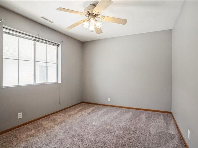 4619 1st Ave Unit 9, Cedar Rapids, IA 52404 - unfurnished room with carpet, a ceiling fan, and baseboards