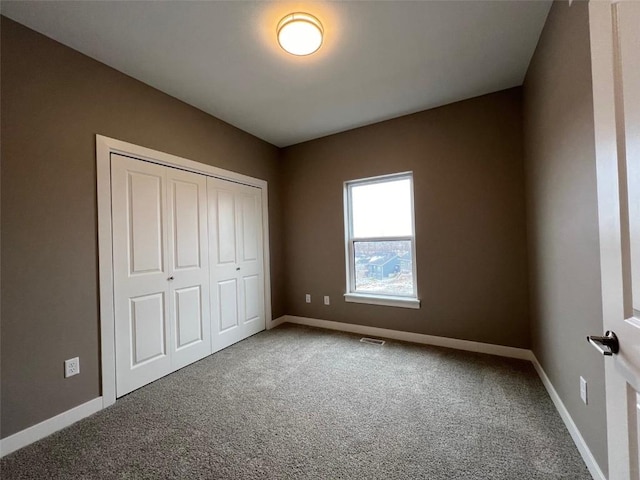 1417 Legend Dr, Tiffin, IA 52340 - unfurnished bedroom featuring carpet flooring, baseboards, and a closet
