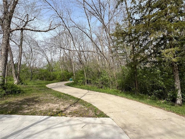 1417 Legend Dr, Tiffin, IA 52340 - surrounding community featuring a forest view