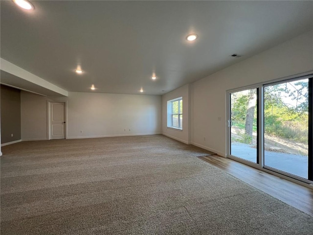 1417 Legend Dr, Tiffin, IA 52340 - unfurnished room featuring baseboards, recessed lighting, and light colored carpet