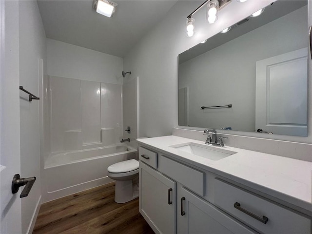 1417 Legend Dr, Tiffin, IA 52340 - bathroom with toilet, vanity, wood finished floors, and shower / tub combination