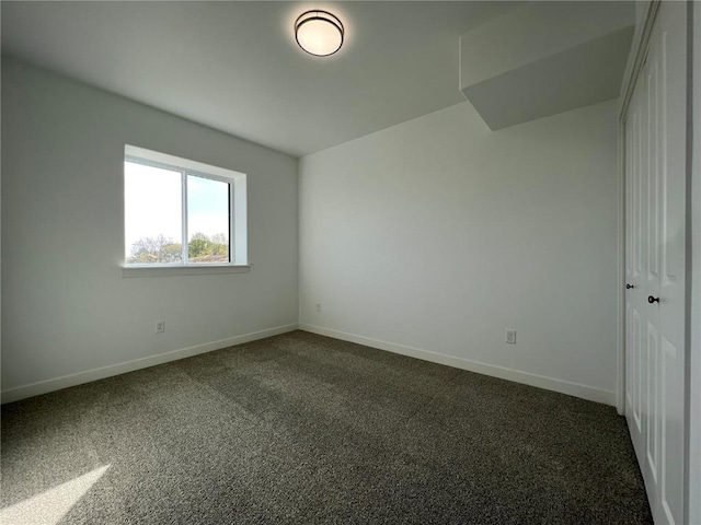 1417 Legend Dr, Tiffin, IA 52340 - unfurnished room featuring dark carpet and baseboards