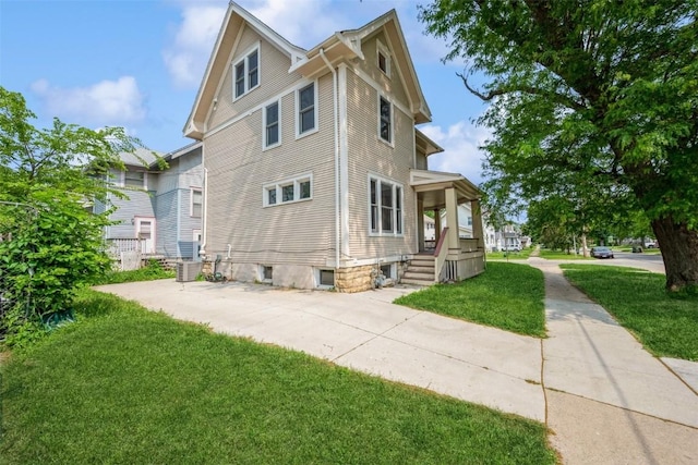 1625 6th Ave, Cedar Rapids, IA 52403 - view of property exterior featuring a yard and central air condition unit