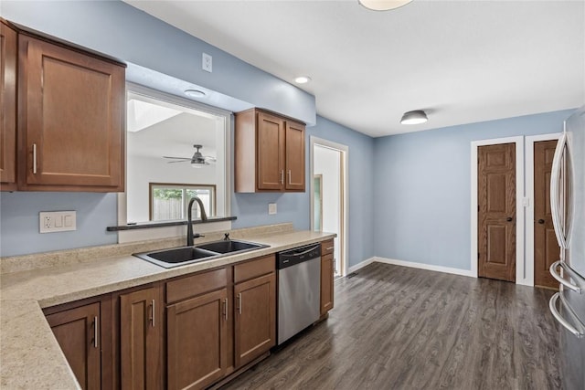 3013 Ravenwood Ter NW, Cedar Rapids, IA 52405 - kitchen featuring stainless steel appliances, a sink, light countertops, a ceiling fan, and dark wood-style floors