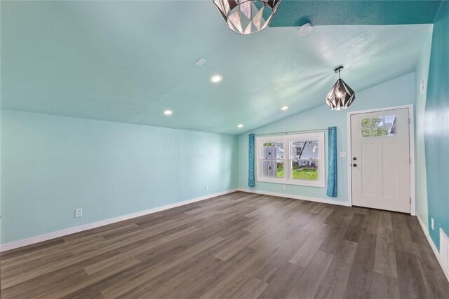 3013 Ravenwood Ter NW, Cedar Rapids, IA 52405 - entrance foyer with lofted ceiling, dark wood-type flooring, baseboards, recessed lighting, and a chandelier