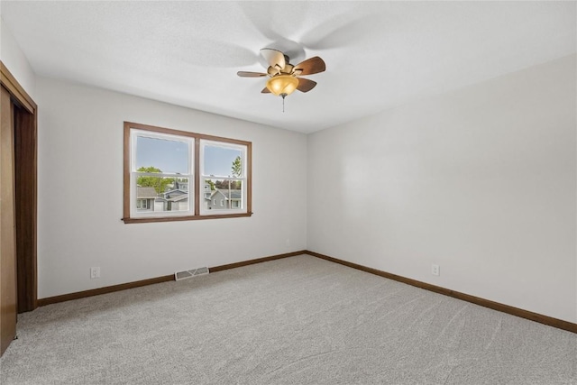 3013 Ravenwood Ter NW, Cedar Rapids, IA 52405 - unfurnished bedroom featuring carpet flooring, baseboards, a closet, and a ceiling fan