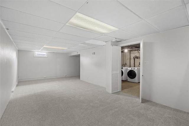 3013 Ravenwood Ter NW, Cedar Rapids, IA 52405 - below grade area with washing machine and dryer, carpet, and a paneled ceiling