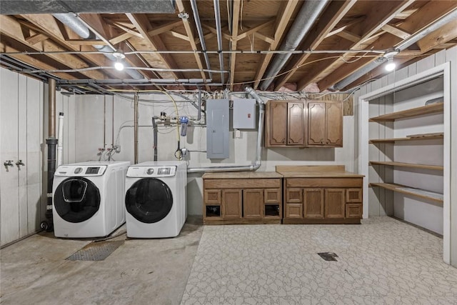 3013 Ravenwood Ter NW, Cedar Rapids, IA 52405 - laundry room featuring washer and clothes dryer, cabinet space, and electric panel