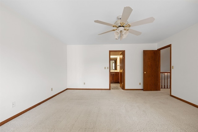 3629 Timberline Dr NE, Cedar Rapids, IA 52402 - spare room with a ceiling fan, baseboards, and light carpet