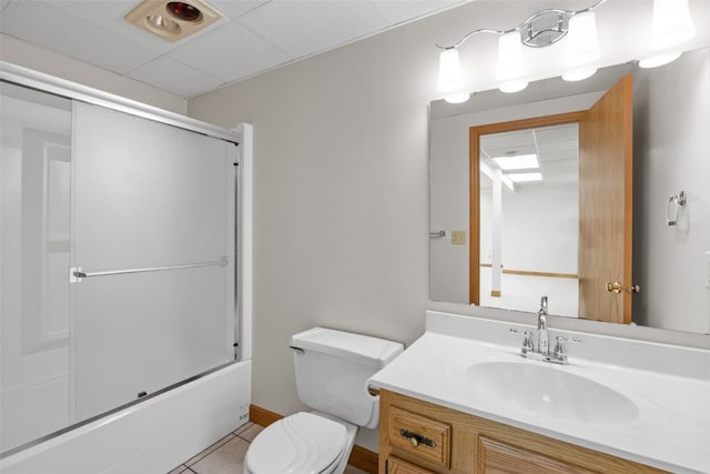 3629 Timberline Dr NE, Cedar Rapids, IA 52402 - bathroom with toilet, vanity, enclosed tub / shower combo, and tile patterned flooring