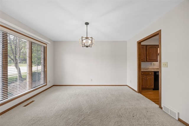 3629 Timberline Dr NE, Cedar Rapids, IA 52402 - carpeted spare room featuring a chandelier and baseboards