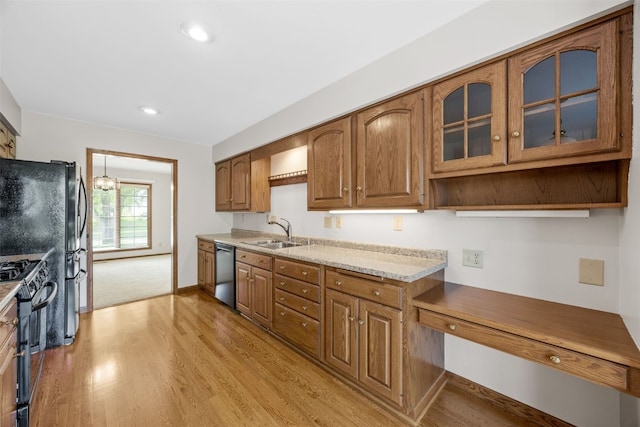 3629 Timberline Dr NE, Cedar Rapids, IA 52402 - kitchen featuring dishwasher, a sink, light wood-style flooring, gas range oven, and brown cabinetry
