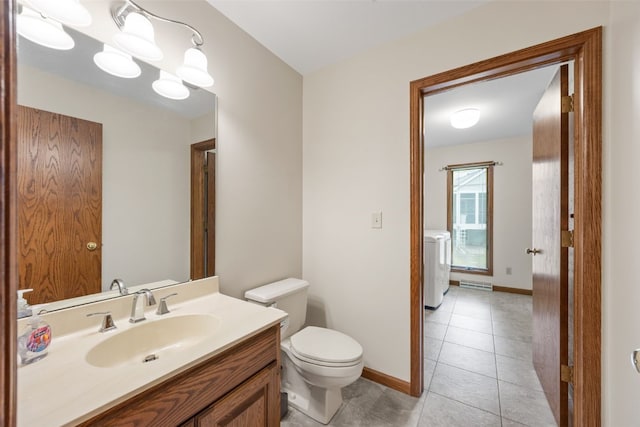 3629 Timberline Dr NE, Cedar Rapids, IA 52402 - bathroom featuring toilet, vanity, tile patterned floors, and baseboards