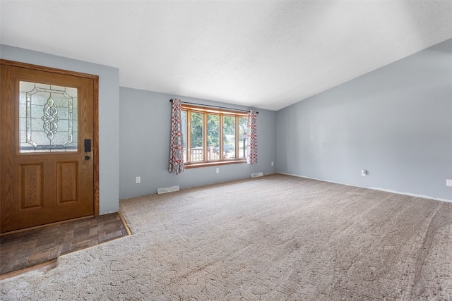 607 E 6th St, Tipton, IA 52772 - carpeted foyer featuring vaulted ceiling