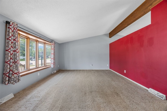 607 E 6th St, Tipton, IA 52772 - spare room featuring carpet and a textured ceiling