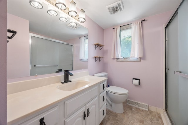 607 E 6th St, Tipton, IA 52772 - bathroom featuring a stall shower, vanity, toilet, and baseboards
