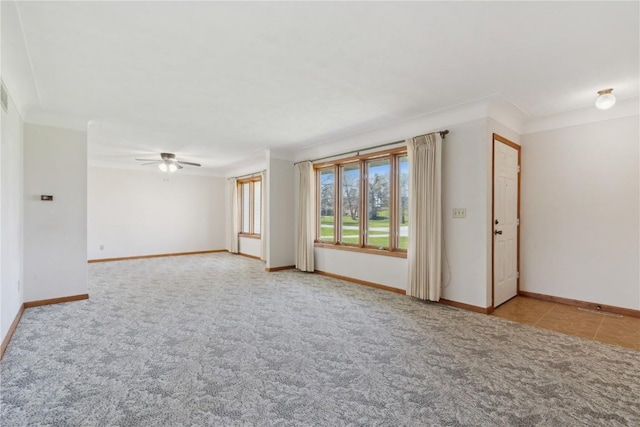 6405 Hillcrest Rd, Cedar Rapids, IA 52404 - carpeted spare room with baseboards and a ceiling fan
