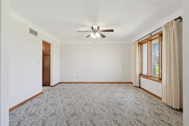 6405 Hillcrest Rd, Cedar Rapids, IA 52404 - carpeted empty room with ceiling fan, baseboards, and crown molding