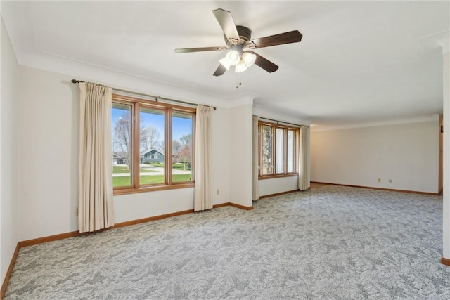 6405 Hillcrest Rd, Cedar Rapids, IA 52404 - carpeted empty room with healthy amount of natural light, baseboards, a ceiling fan, and crown molding