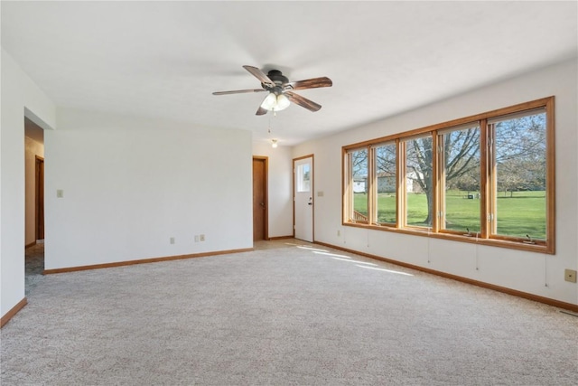 6405 Hillcrest Rd, Cedar Rapids, IA 52404 - empty room featuring healthy amount of natural light, ceiling fan, and baseboards