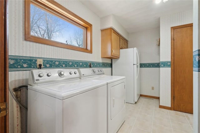 6405 Hillcrest Rd, Cedar Rapids, IA 52404 - washroom with wallpapered walls, washing machine and dryer, and light tile patterned floors