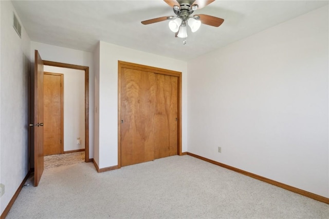 6405 Hillcrest Rd, Cedar Rapids, IA 52404 - unfurnished bedroom featuring light colored carpet, a closet, and baseboards