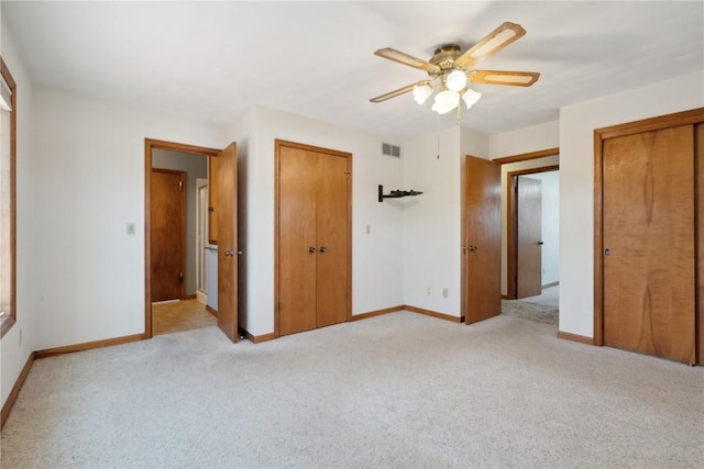 6405 Hillcrest Rd, Cedar Rapids, IA 52404 - unfurnished bedroom featuring baseboards, light colored carpet, and ceiling fan