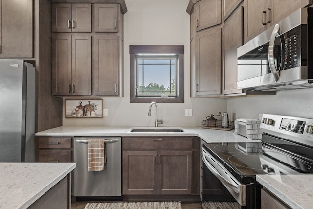 1871 Ellis Blvd NW Unit 309, Cedar Rapids, IA 52405 - kitchen with appliances with stainless steel finishes, a sink, and light countertops