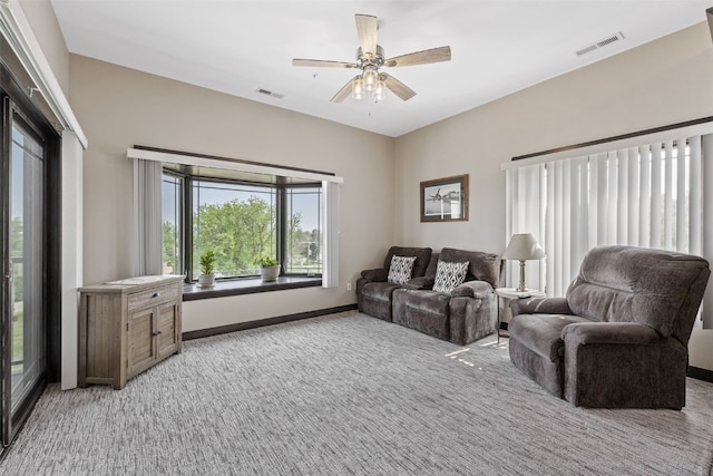 1871 Ellis Blvd NW Unit 309, Cedar Rapids, IA 52405 - living area with plenty of natural light, light carpet, and a ceiling fan