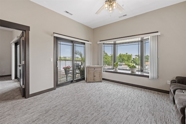 1871 Ellis Blvd NW Unit 309, Cedar Rapids, IA 52405 - living area with light colored carpet, ceiling fan, and plenty of natural light