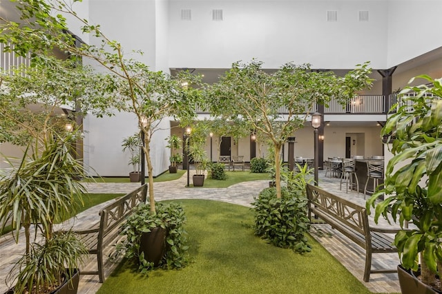 1871 Ellis Blvd NW Unit 309, Cedar Rapids, IA 52405 - view of grassy yard featuring a patio area, outdoor dining area, and a balcony
