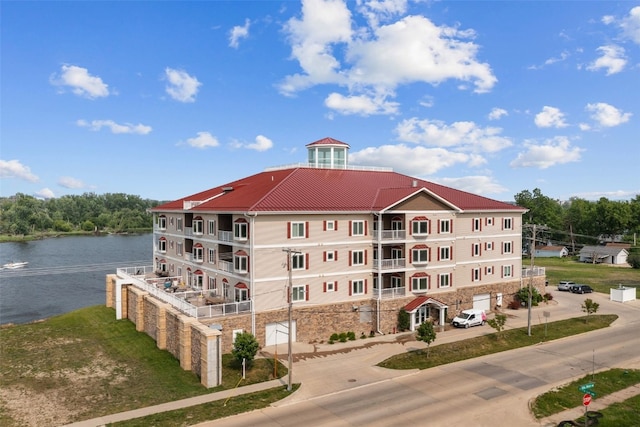 1871 Ellis Blvd NW Unit 309, Cedar Rapids, IA 52405 - view of building exterior featuring a water view