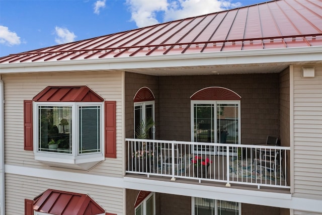 1871 Ellis Blvd NW Unit 309, Cedar Rapids, IA 52405 - view of property exterior featuring a standing seam roof and metal roof