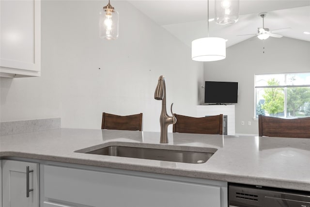 1333 Truman Ct NE Unit B, Cedar Rapids, IA 52402 - kitchen featuring dishwasher, a sink, vaulted ceiling, ceiling fan, and light stone counters